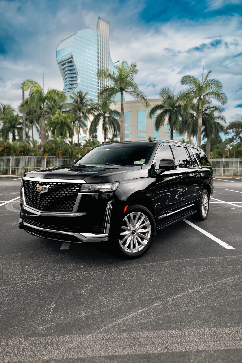 Front view of the black Cadillac Escalade ESV outside the Guitar Hotel