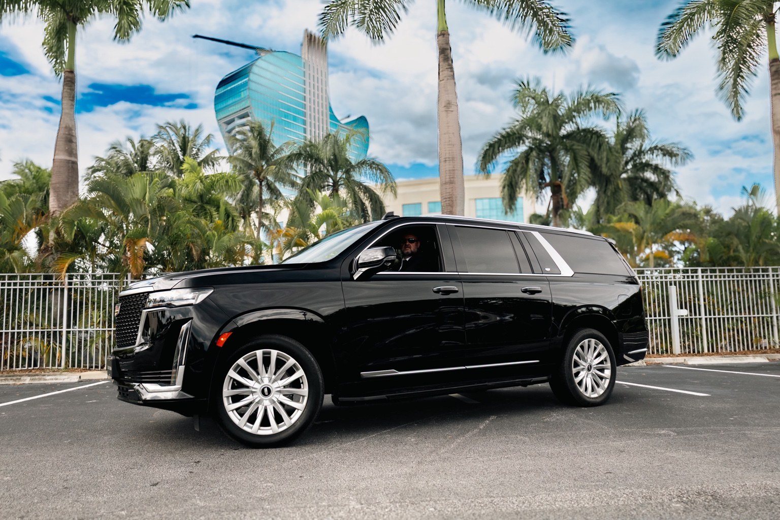 Side view of the Luxury Rides Miami black Cadillac Escalade ESV